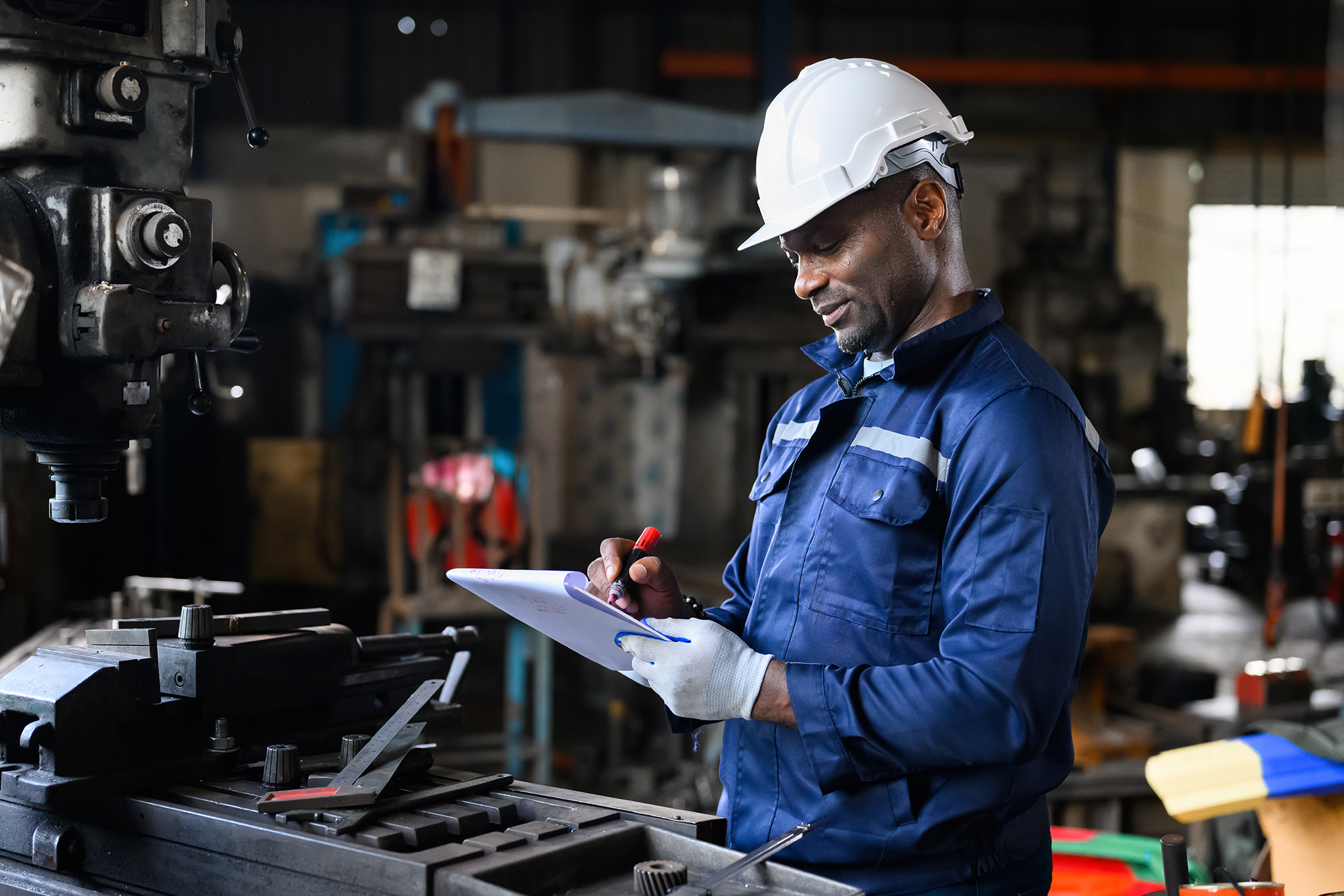 Large Ontario manufacturing facility interior with heavy industrial machinery highlighting insurance solutions for industrial businesses in Ontario.