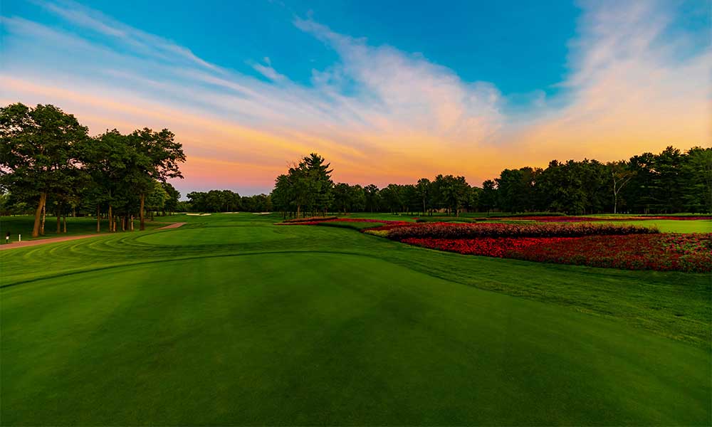 A well-maintained Ontario golf course with clubhouse and fairways, representing comprehensive golf course insurance coverage.