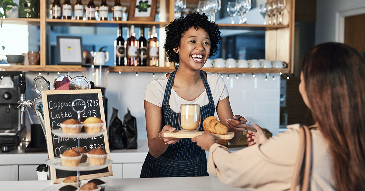 Interior of an Ontario restaurant bar with patrons enjoying food and drinks, representing tailored hospitality insurance coverage for restaurants and bars.