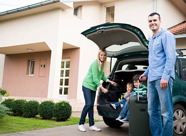 Ontario homeowner beside their car and household possessions, illustrating auto and contents coverage in personal insurance