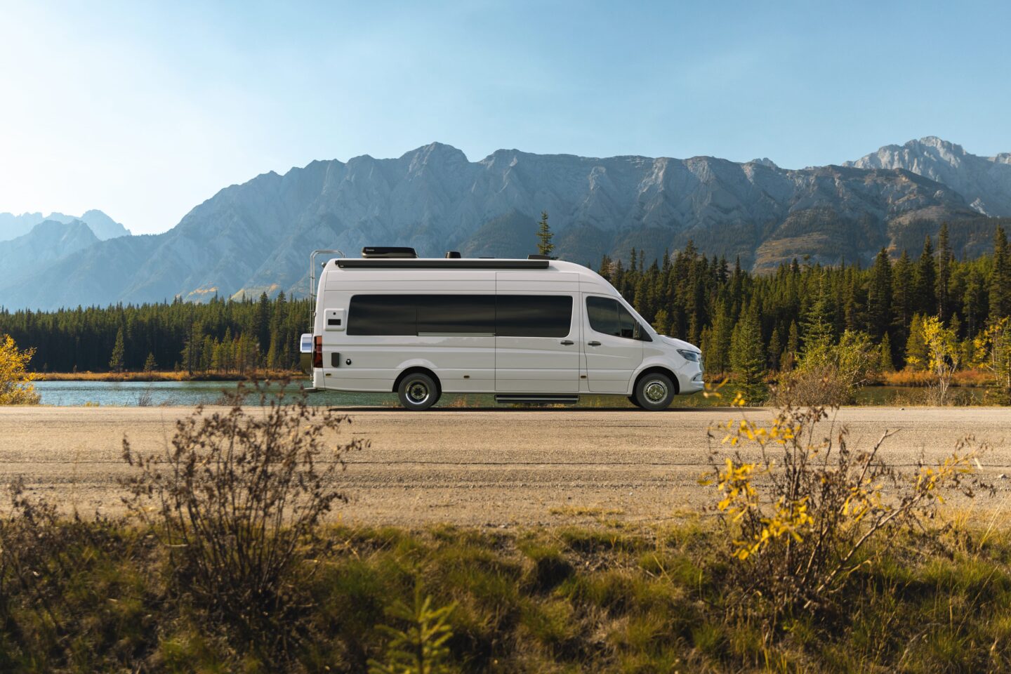 Motorhome driving on a scenic Ontario highway, representing recreational vehicle insurance for Ontario owners